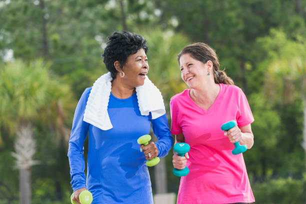 istock Two mature women in the park exercising 842689822