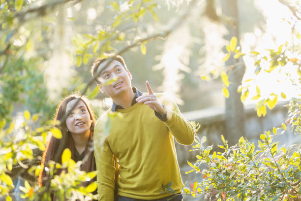 istock Asian couple at a park in autumn 842691470