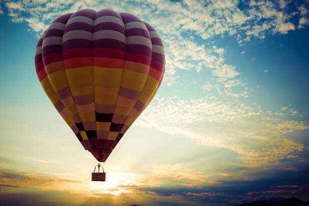 istock Colorful hot air balloon flying on sky at sunset 842700716