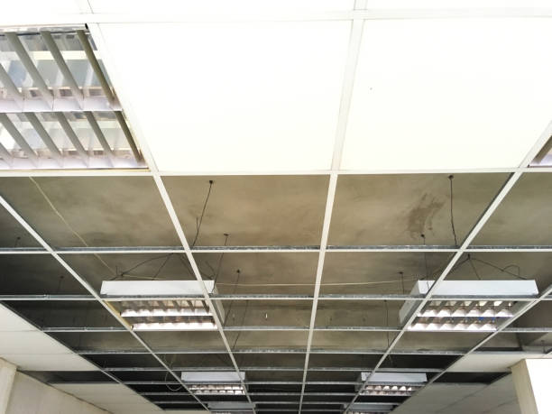 istock structure of ceiling suspension, installation of gypsum plasterboard and light. 842710324