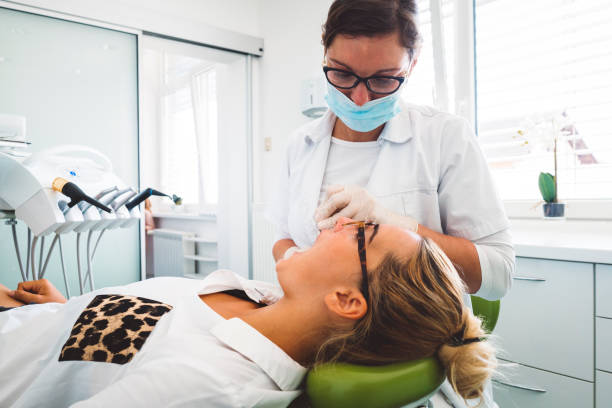 istock Young woman at the dentist 842711446