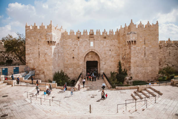 Jerusalem,Israel November 1st 2016: Group of locals walking at the Damascus gate at Jerusalem old city,Israel. Damascus gate is one of the oldest gates at the Muslim area in Jerusalem.