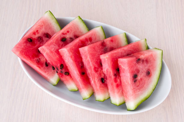 istock Ripe watermelon slices in a plate is on the table 842726286