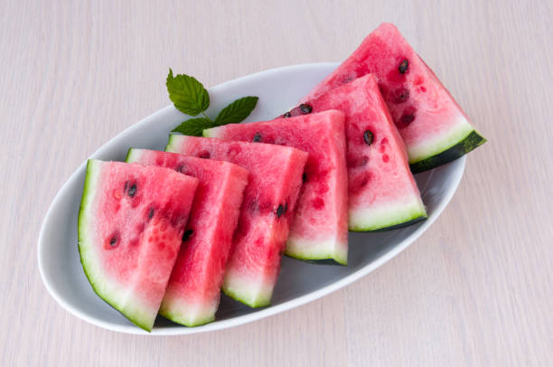 istock Ripe watermelon slices in a plate is on the table 842726332
