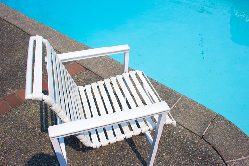 White chair by the private pool side