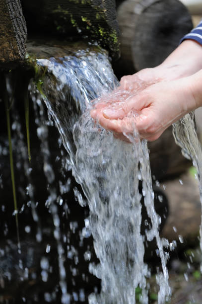 istock Water pouring in woman hand 842743658
