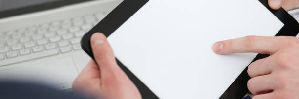 istock Businessmen reading financial review at tablet pc 842744558