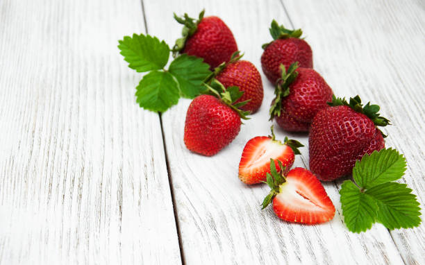 istock ripe strawberries on wooden table 842747356