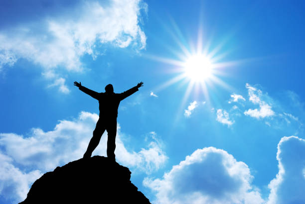 istock Man on peak of mountain. 842747740
