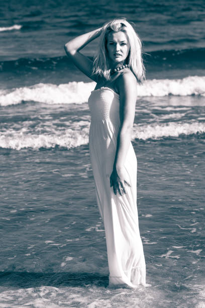 istock Beautiful woman on sunny beach. 842748412