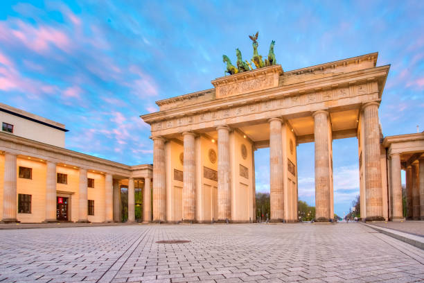 istock Dramatic sky with Brandenburg gate in Berlin city, Germany 842750960