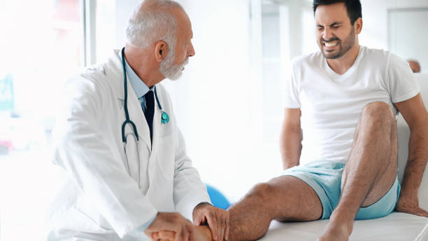 istock Young man having his ankle examined. 842752034