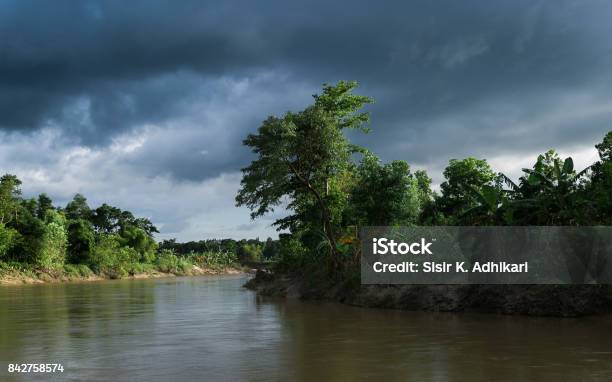 Muddy River Bank Before The Rain Stock Photo - Download Image Now - Riverbank, Storm Cloud, Bangladesh