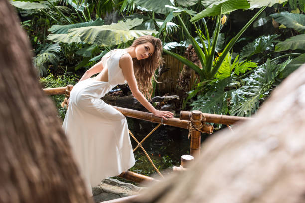 istock woman in tropical orangery 842764040