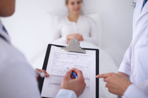 istock A group of doctors discussing medical history close up 842765088
