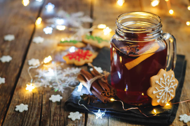 istock Mulled wine with gingerbread cookies and Christmas light 842772712