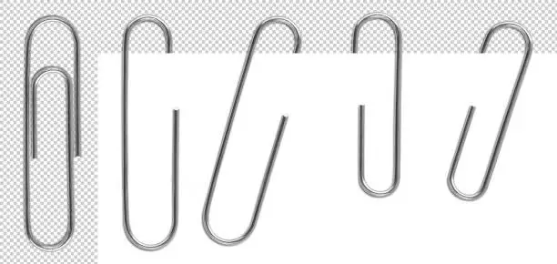 Classic metal paper clips isolated and attached to paper in different way.