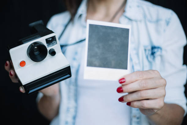 istock Old camera and photo closeup 842773232