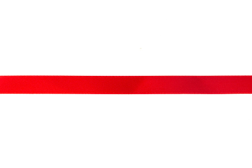 Red ribbon with bow isolated on white background.