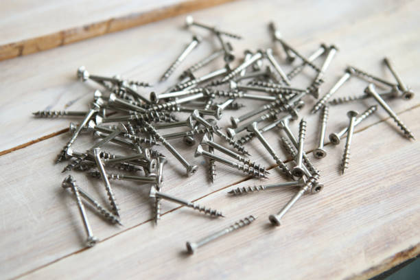 istock Wood screws on wooden planks. 842789106