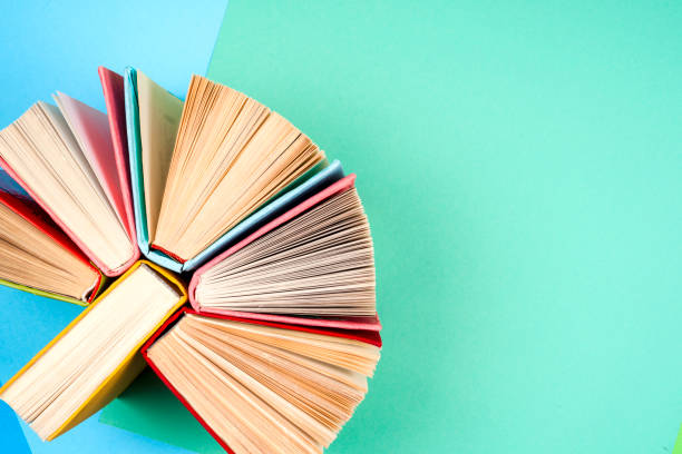 top view of bright colorful hardback books in a circle. - brown paper imagens e fotografias de stock