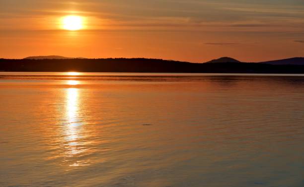 istock Golden sun sinks over the lake in the evening 842790366