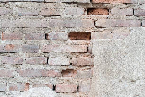 istock cracked concrete vintage brick wall background 842801174