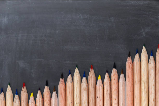 istock Blank chalkboard as background with wave of colorful pencils 842809718