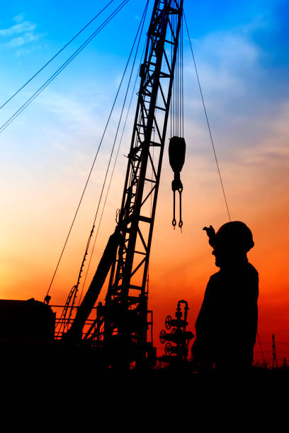 istock oil field, the oil workers are working 842814374