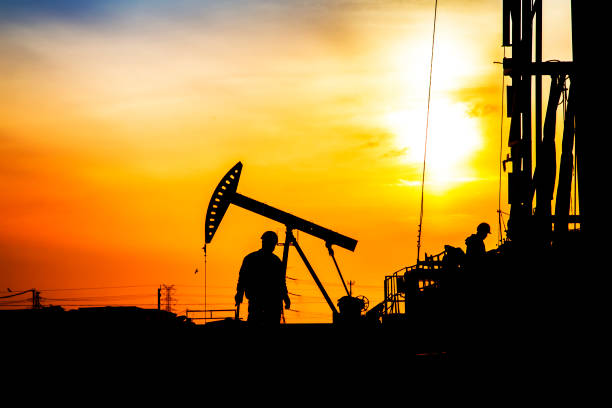istock oil field, the oil workers are working 842816972