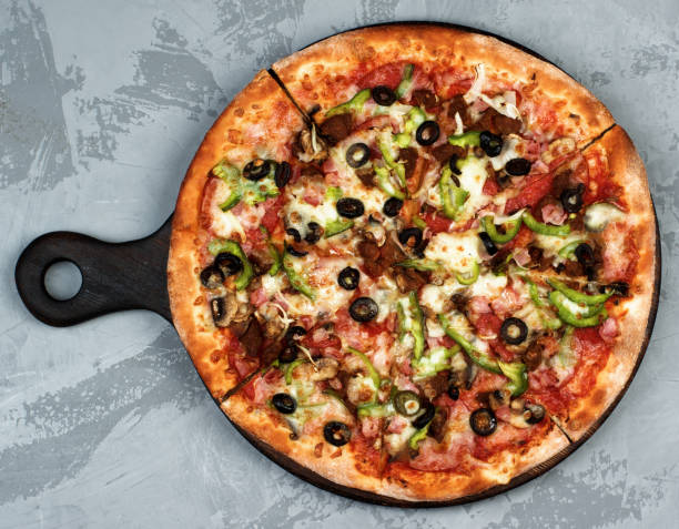 istock Delicious Pizza with Ham, Olives and Jalapenos 842821568