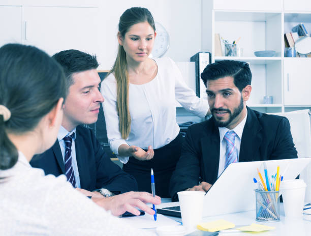 istock Businesswoman with colleagues in office 842825734