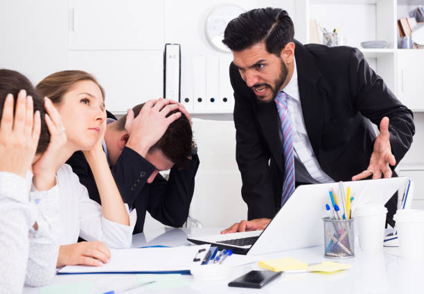 istock Outraged manager with colleagues at meeting 842825736