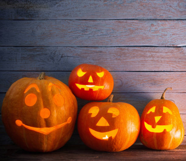 istock pumpkins on wooden background with copy space 842826430