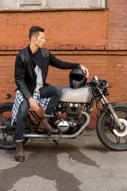 istock Brutal man sit on cafe racer custom motorbike. 842826456