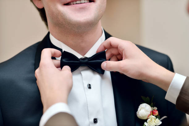 istock Groom is wearing a suit indoors 842826632