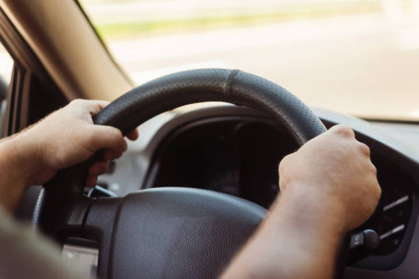 istock man's hands on the steering wheel retro toning car 842829438