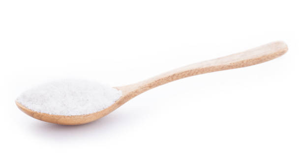 istock Salt in wooden spoon on white background 842837350