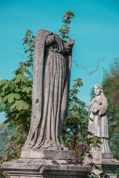 Statue of little boy Angel at Rasu cemetery in Vilnius, Lithuania. Black and white image