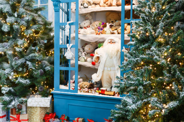 istock Christmas is coming. Decorated fir trees and presents background 842848634