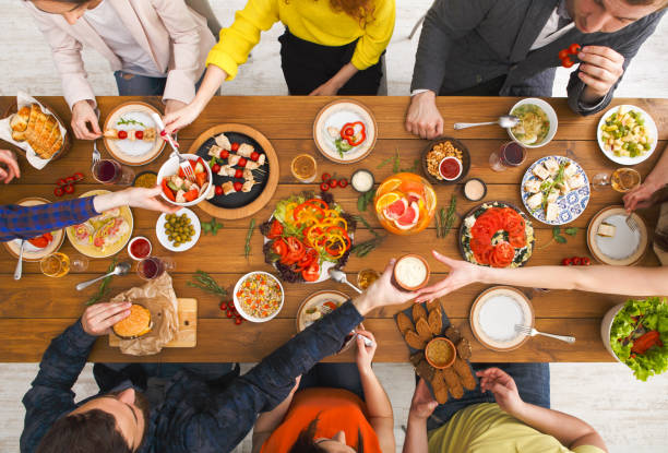 istock People eat healthy meals at served table dinner party 842852738