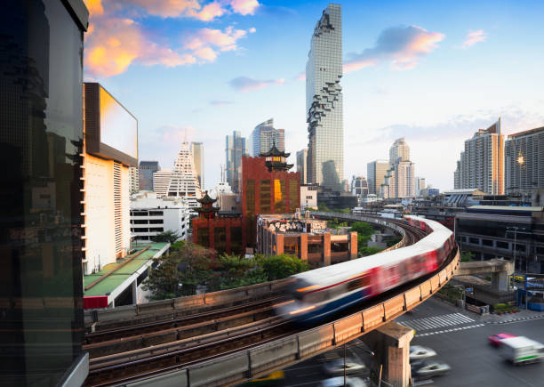 Bangkok city skyline BTS skytrain and Mahanakhon building in background at Bangkok business's district at silom road, Bangkok Thailand silom stock pictures, royalty-free photos & images