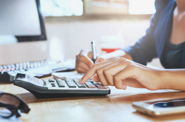 istock businessman working on desk office using calculator business financial accounting concept 842852970
