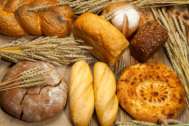 istock fresh bread and wheat on the wooden 842858396