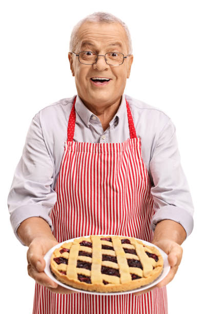 istock Mature man offering freshly baked pie 842858800