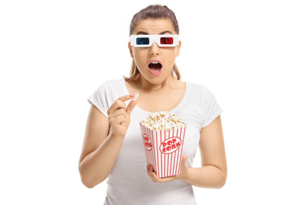 istock Scared girl with 3D glasses and popcorn 842861012