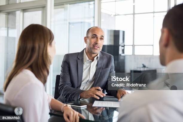 Financial Advisor With Clients Stock Photo - Download Image Now - Financial Advisor, Meeting, Customer