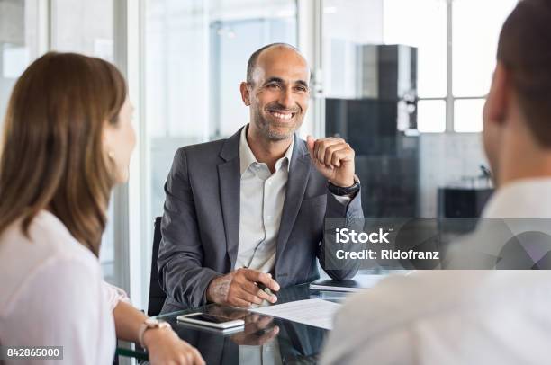 Happy Financial Agent Smiling Stock Photo - Download Image Now - Financial Advisor, Customer, Advice