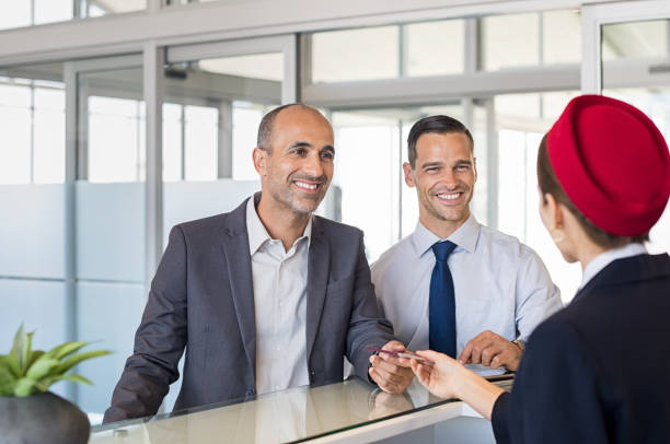 istock Two businessmen at airport check in 842865070