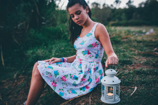 istock young woman with lantern exploring in nature 842868816
